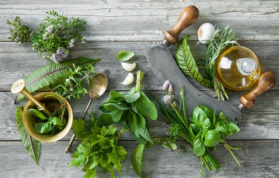 fresh kitchen herbs and spices on wooden table. Top view
